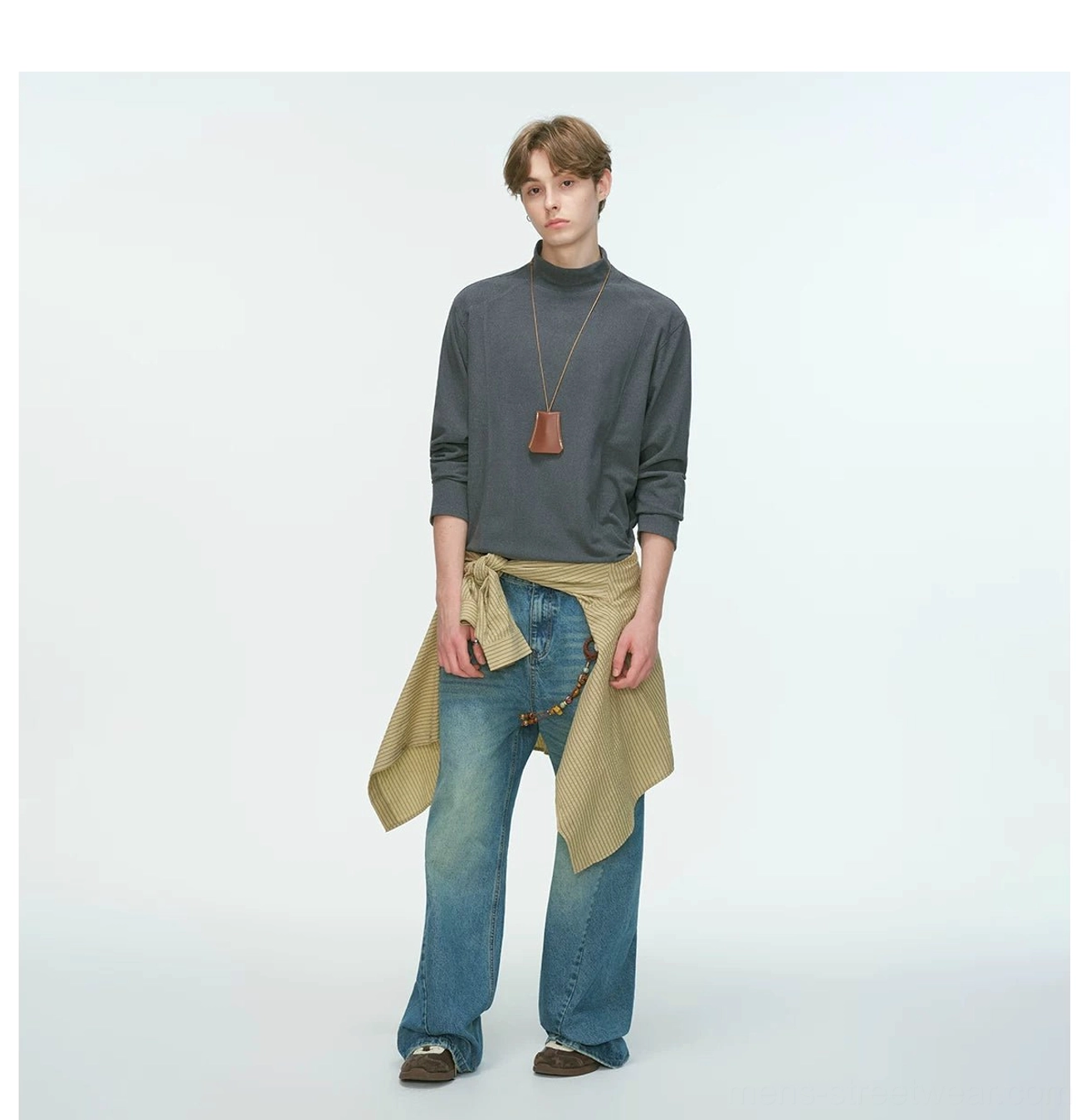 Charcoal gray Korean streetwear mock neck top styled with a khaki shirt, leather pendant necklace, and jeans waist chain