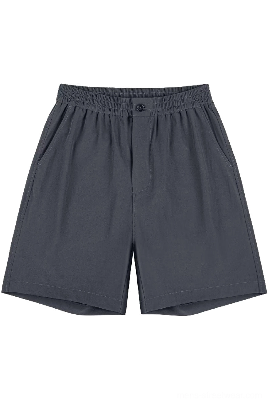 Charcoal gray relaxed fit outdoor tech shorts in heavyweight cotton shown from the front on white background