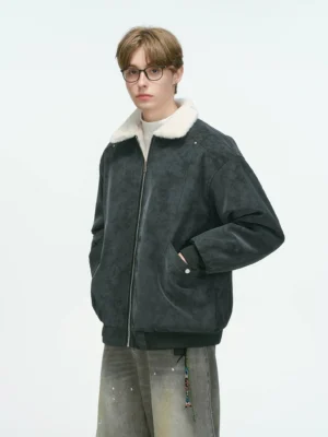 Dark charcoal gray reversible shearling collar bomber jacket with plush white collar styled with wide-leg denim