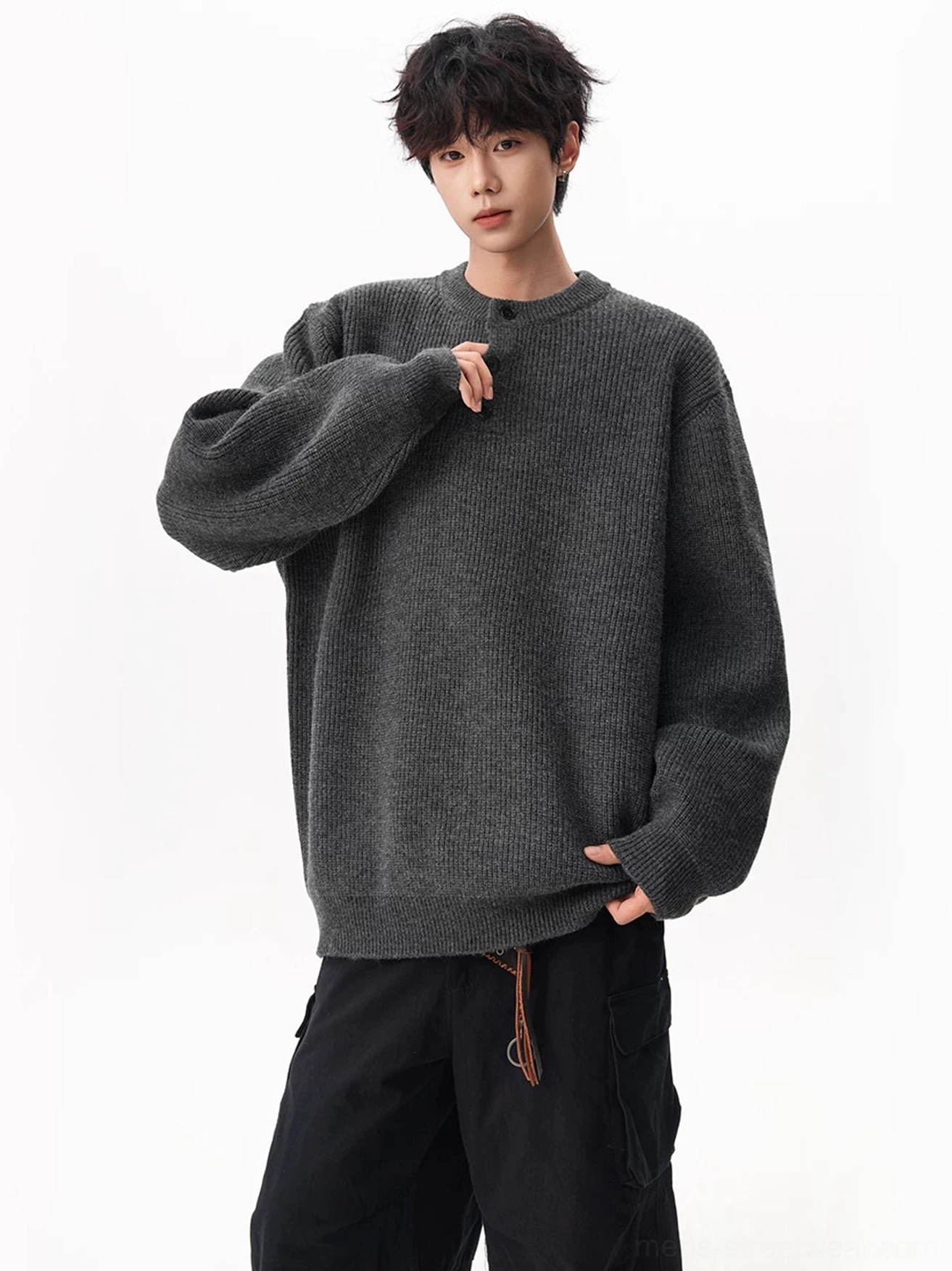 Charcoal gray oversized waffle Henley sweater styled with black cargo pants for a relaxed Seoul streetwear outfit