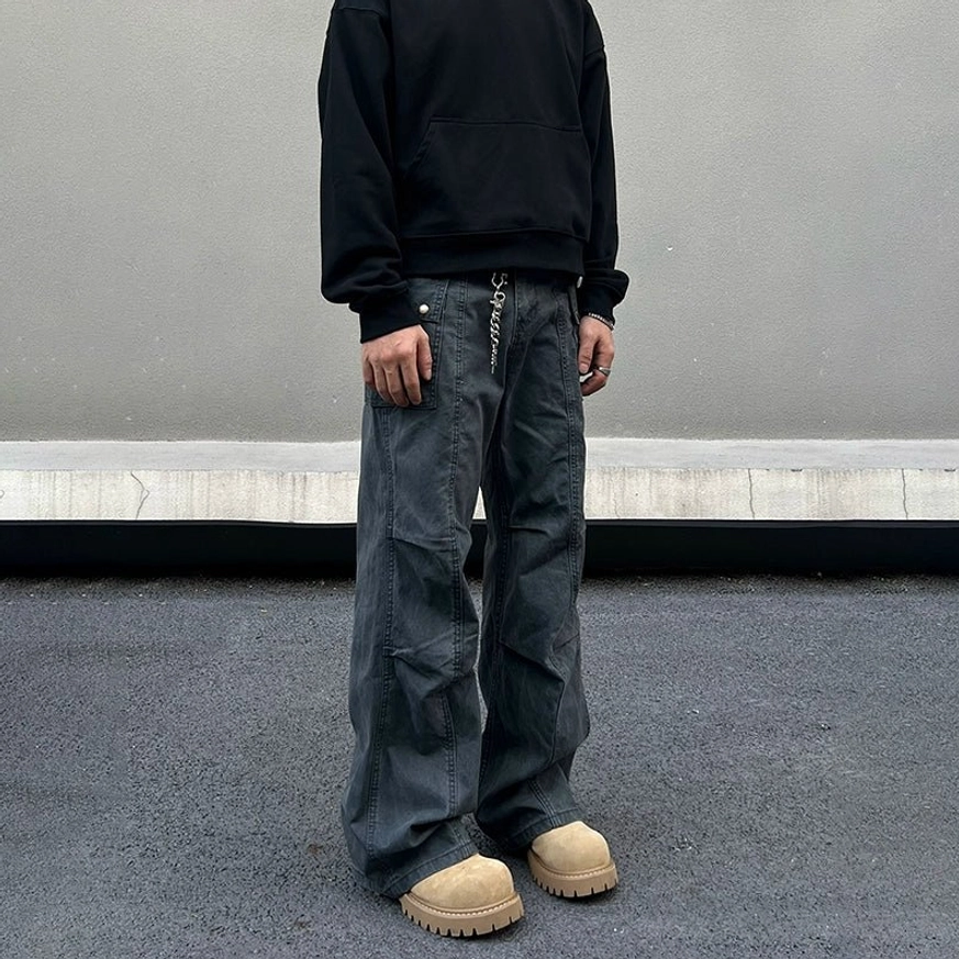Charcoal grey fleece lined wide leg utility cargo pants with cargo pockets and metal waist chain front view