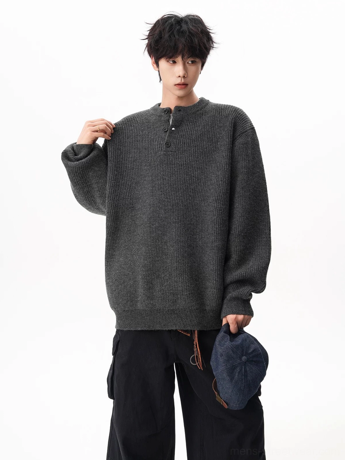 Charcoal oversized Henley knit sweater showing textured waffle ribbing and a relaxed Korean casual streetwear silhouette