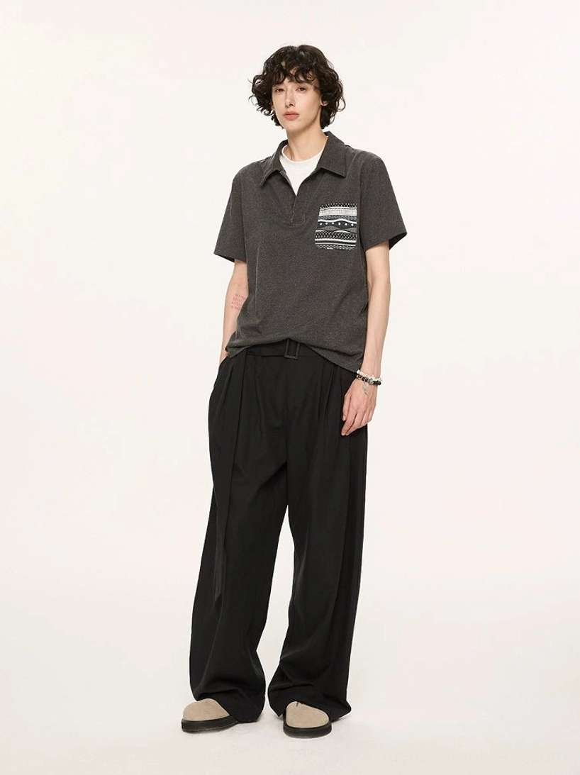 Charcoal relaxed fit short sleeve polo styled with black wide leg trousers in Korean streetwear inspired studio outfit