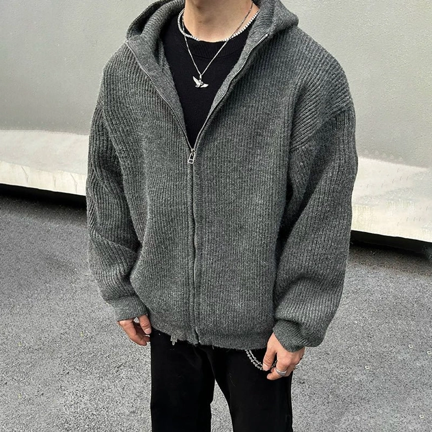 Close-up front view of charcoal rib-knit zip hoodie with roomy hood full zipper textured fabric and black T-shirt layering