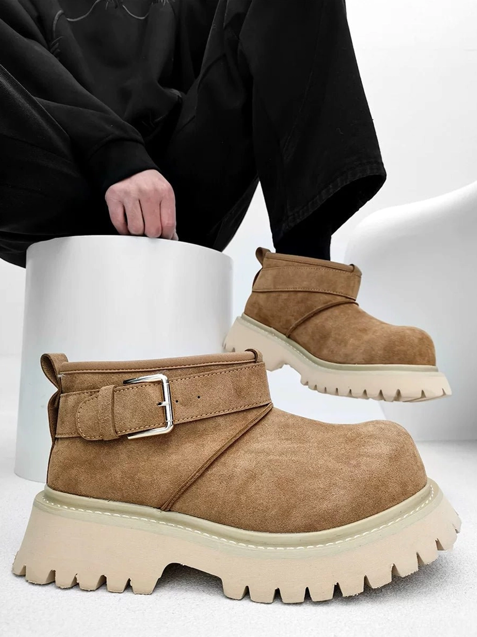 Chestnut brown suede-finish platform ankle boots with silver buckle strap, fleece lining, and chunky lug outsole