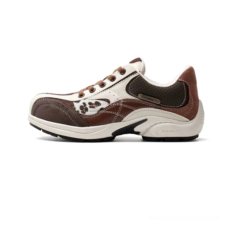 Chestnut and cream two-tone retro running sneakers with suede-style panels, brown laces, and casual streetwear color blocking