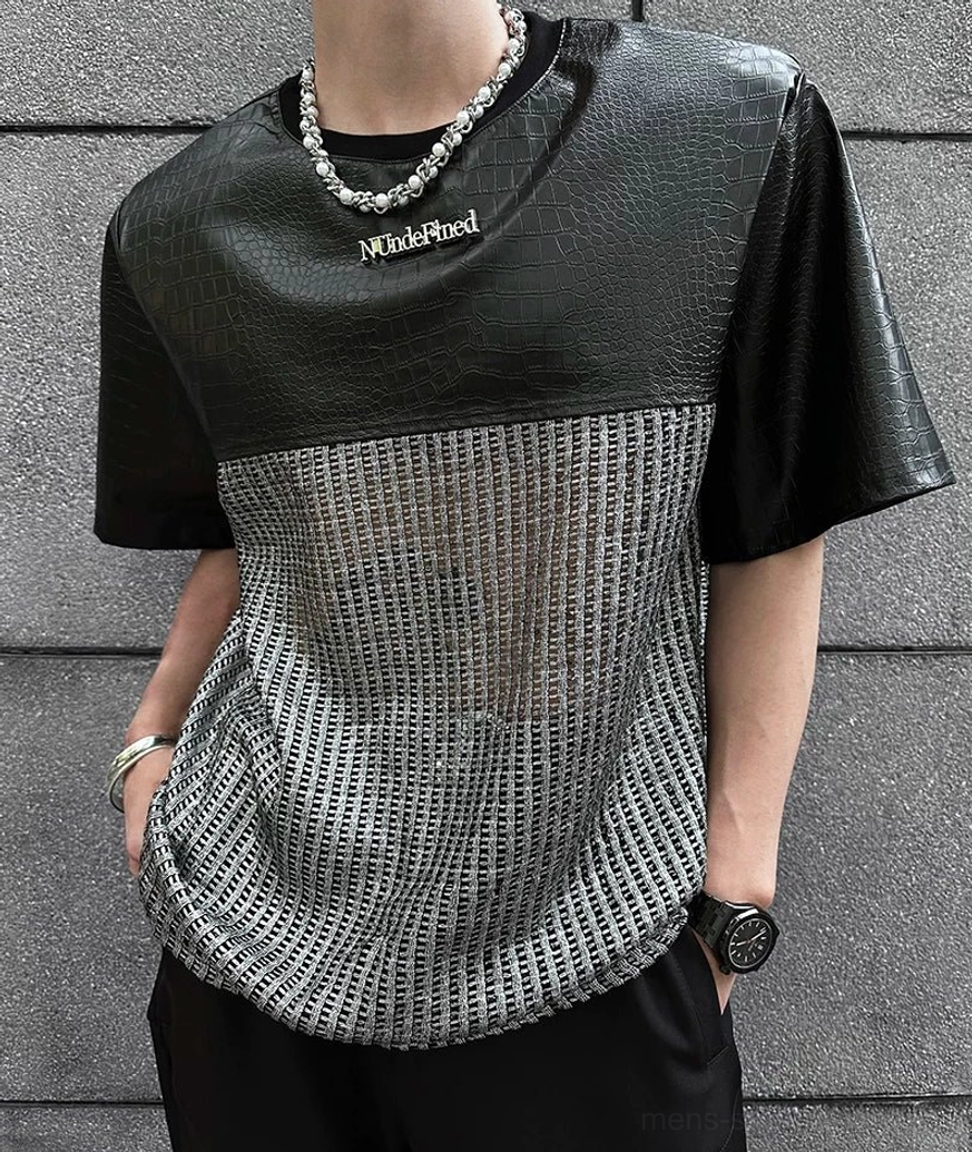 Chrome grid patchwork techwear T-shirt in black and silver with futuristic metallic texture and relaxed Acubi streetwear silhouette
