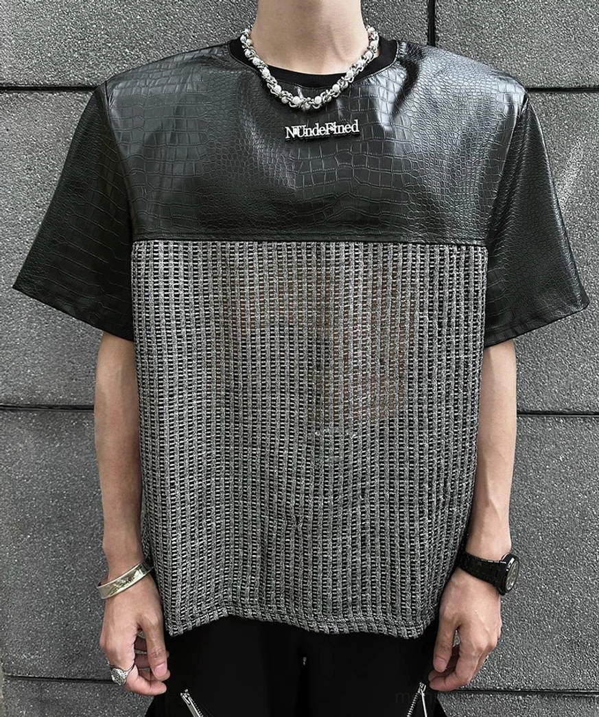 Relaxed fit chrome grid patchwork T-shirt featuring a futuristic silver grid body, black upper panels, and modern techwear detailing
