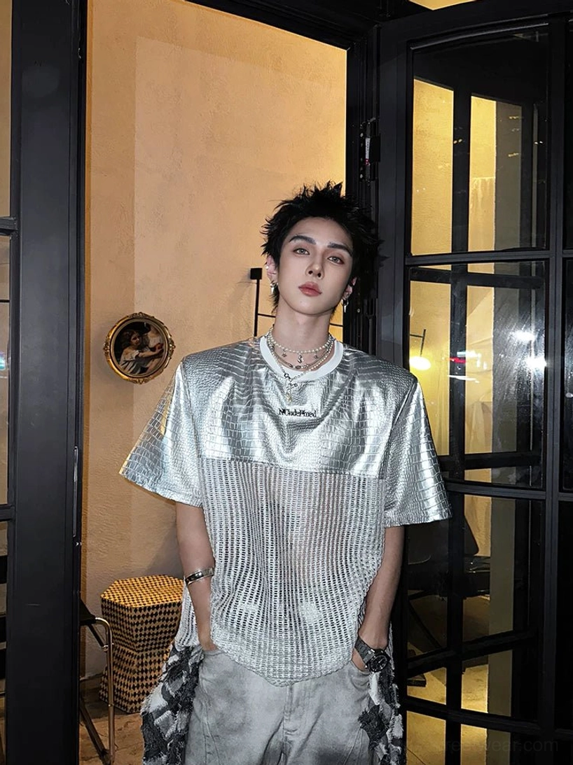 Silver chrome grid patchwork techwear T-shirt with metallic upper panels, ribbed woven body, relaxed crew neck, and futuristic streetwear aesthetic