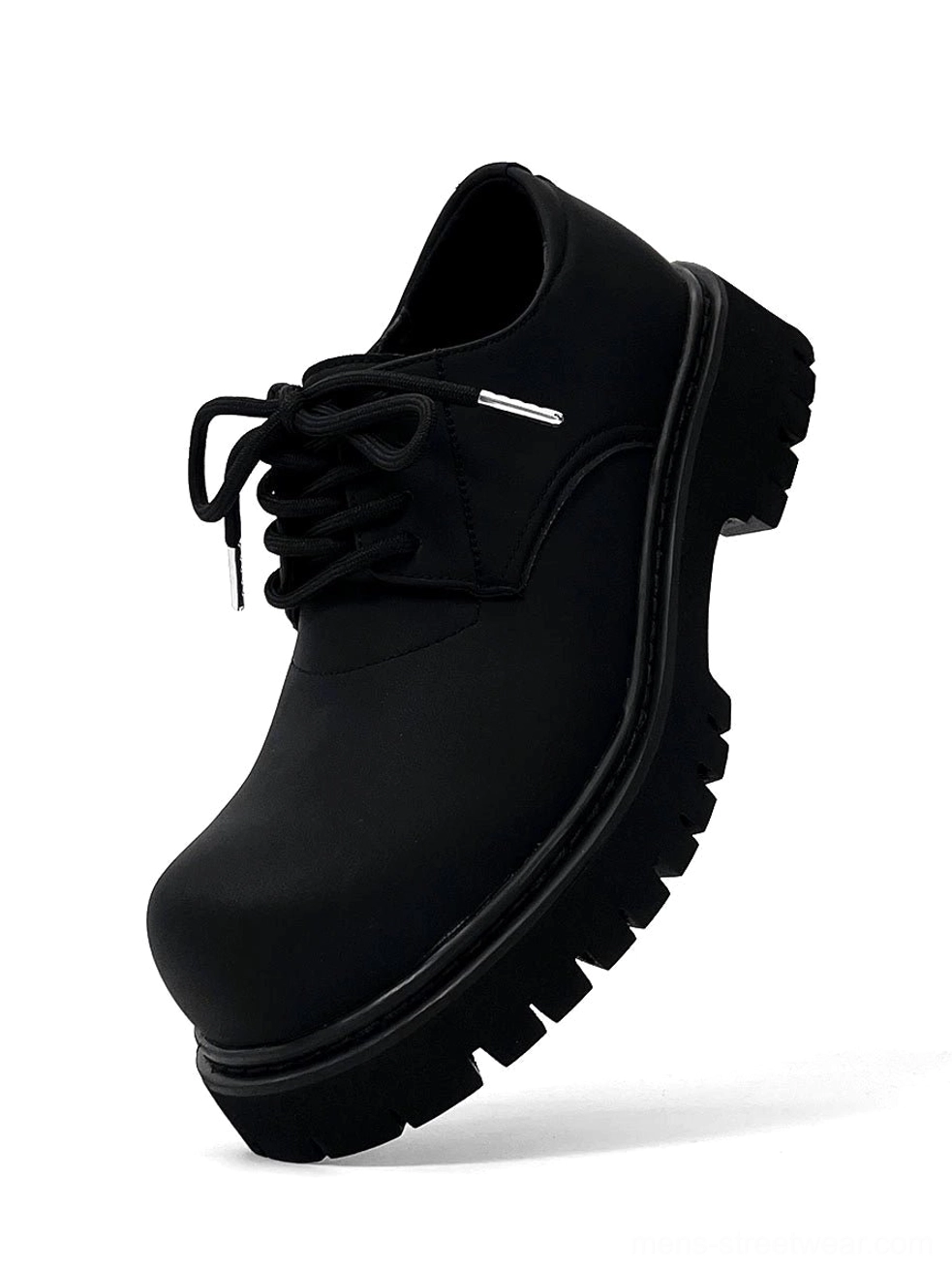 Single chunky black platform derby shoe in a front three-quarter studio view with rounded toe and metallic lace aglets