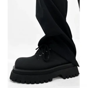 Chunky black platform derby shoes in matte synthetic leather with rounded toe and thick lug sole