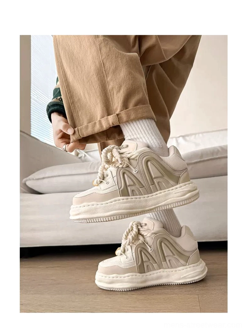Rice color low-cut chunky platform sneakers with rounded thick sole and clean neutral upper