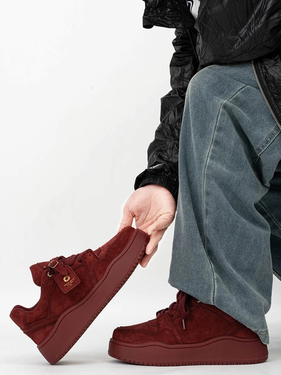 Deep claret burgundy suede platform skate sneaker shown from the side with a retro leather detail and thick elevated rubber sole