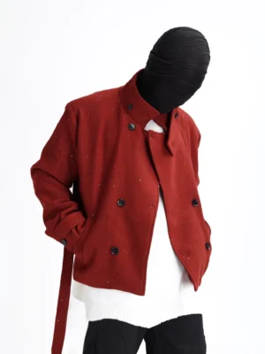 Claret burgundy speckled cropped officer coat with asymmetric stand collar and double-breasted front worn with white oversized sweater