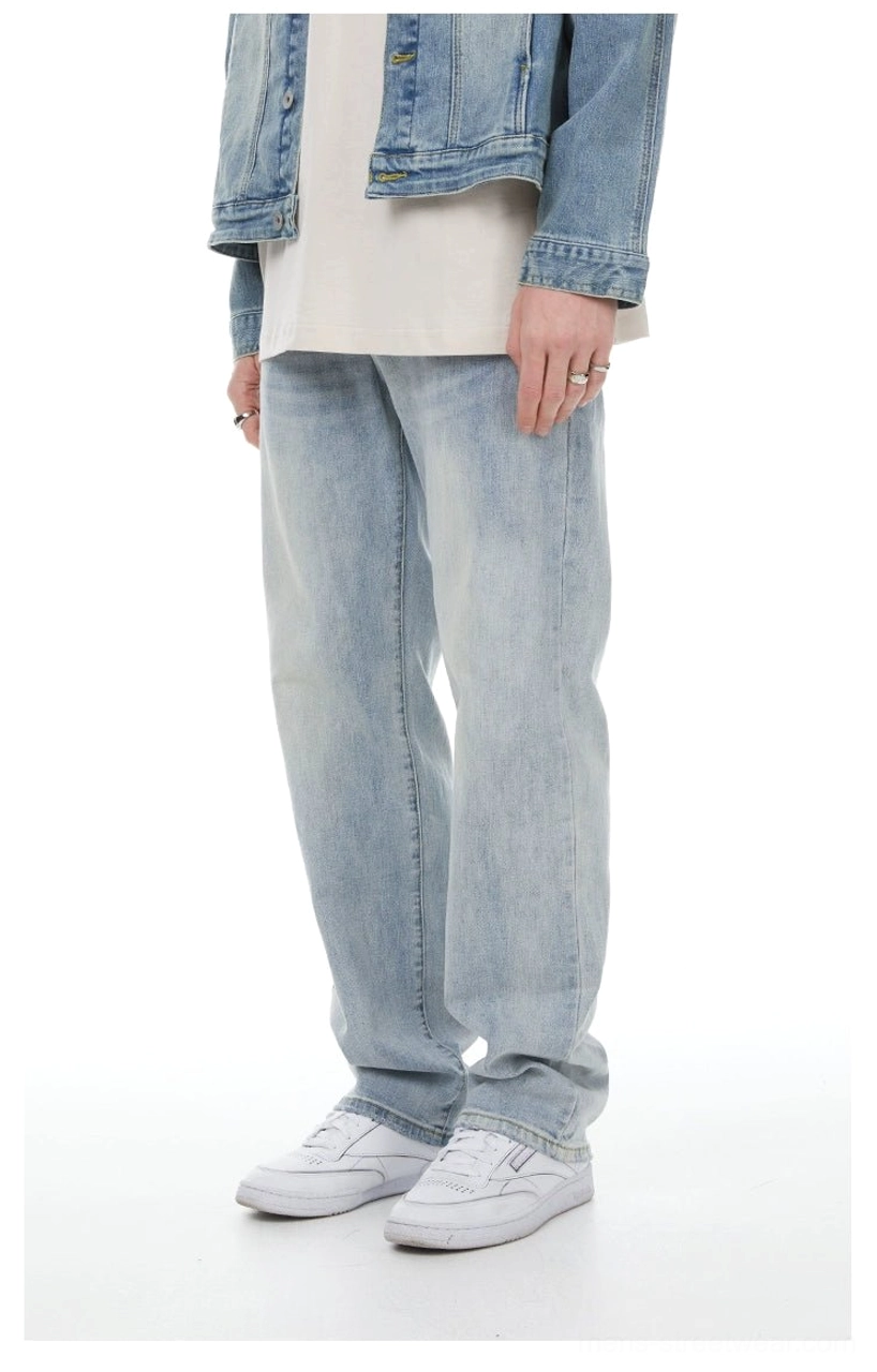 Classic light blue straight-leg denim jeans styled with a denim jacket and clean white sneakers