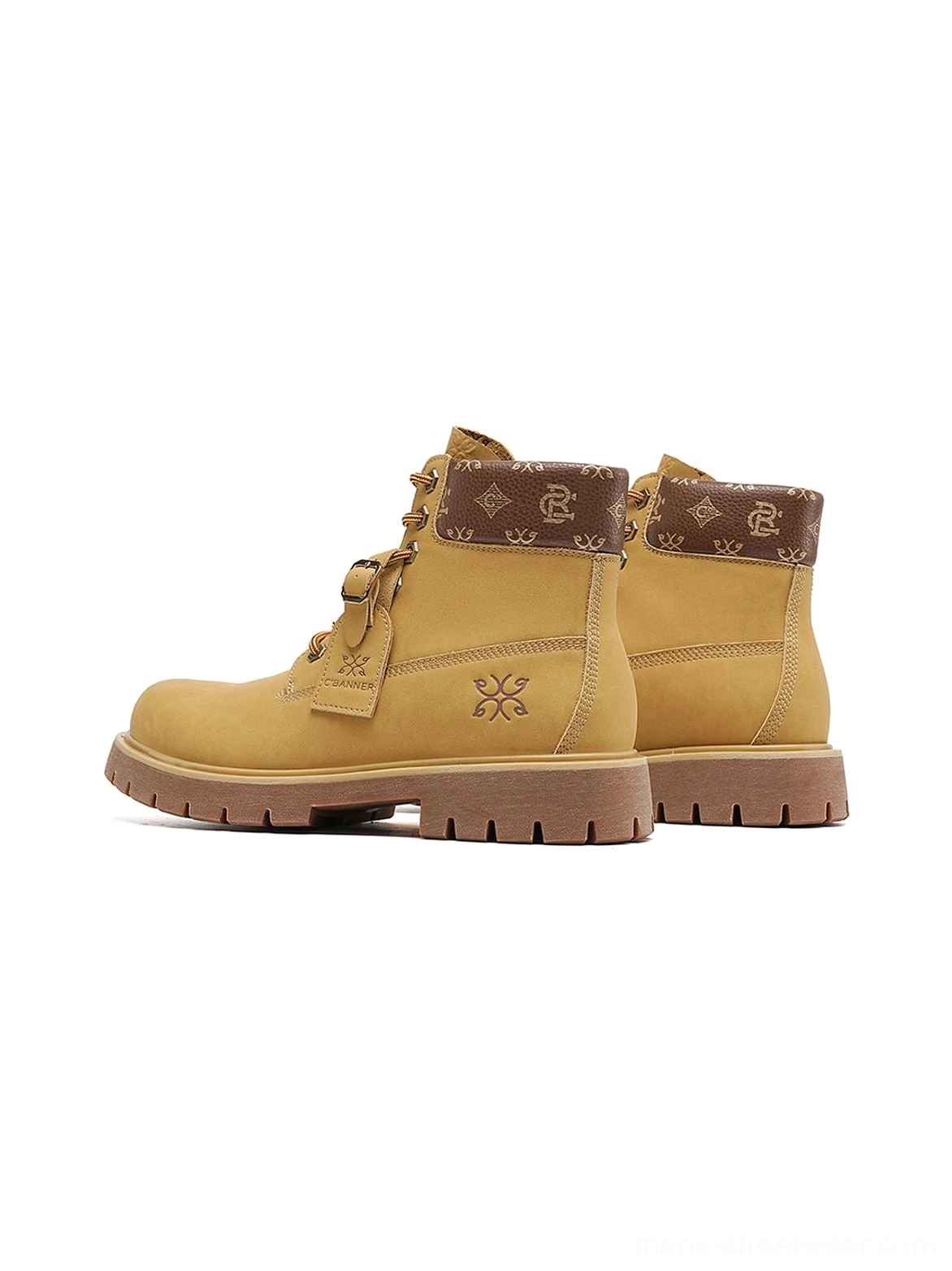 Classic wheat work boots with deep lug tread, contrast brown collar, embossed snowflake detail, and urban utility streetwear character