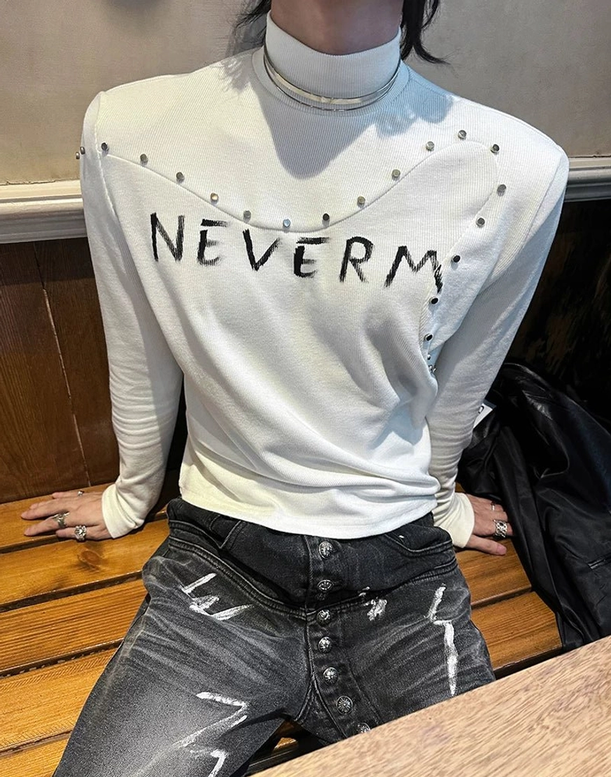 Close-fitting gothic streetwear knit sweater with distressed chest lettering and metallic stud detailing around the collar