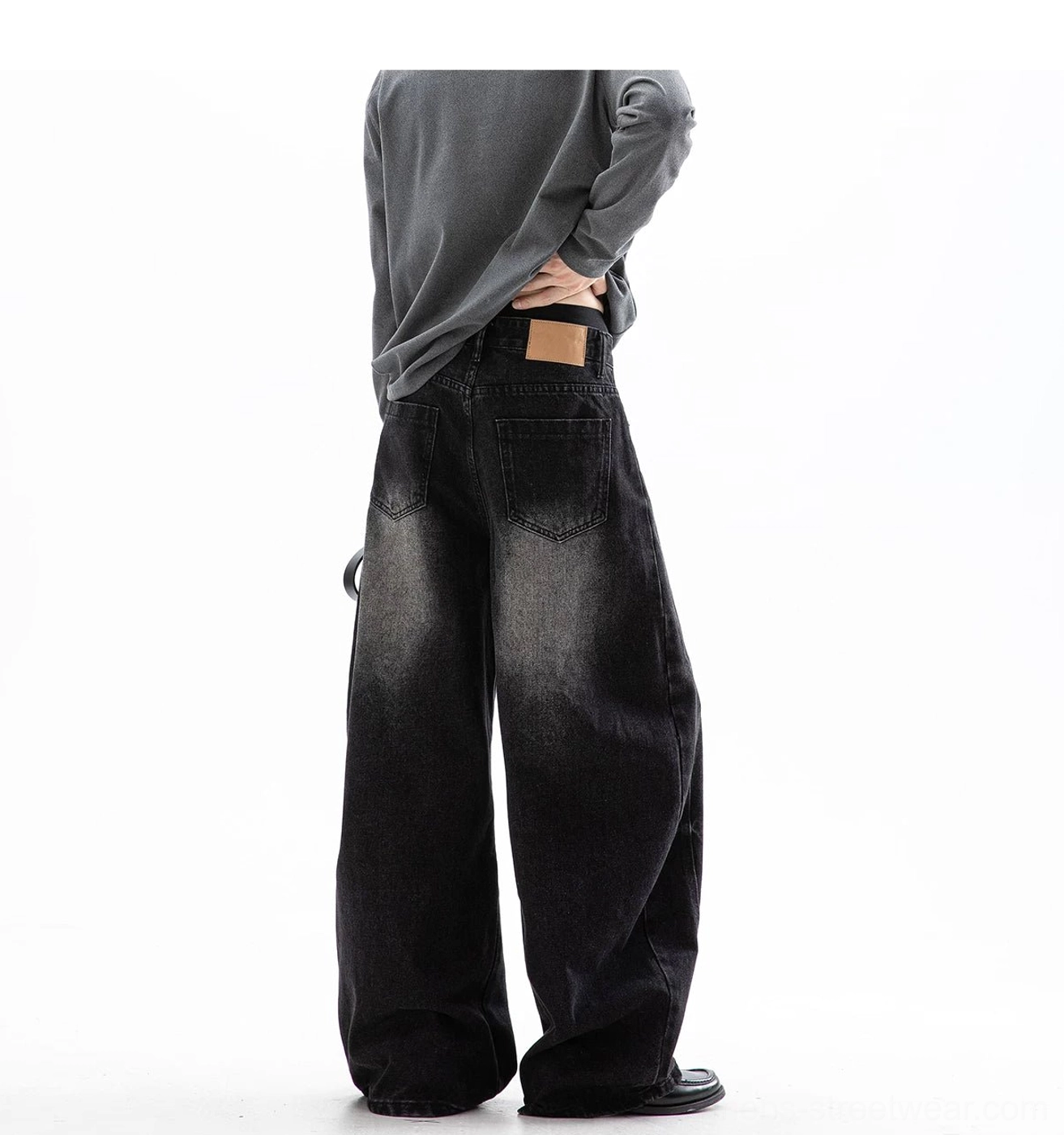 Back view of black cloud washed ultra wide leg jeans with classic rear pockets and relaxed silhouette