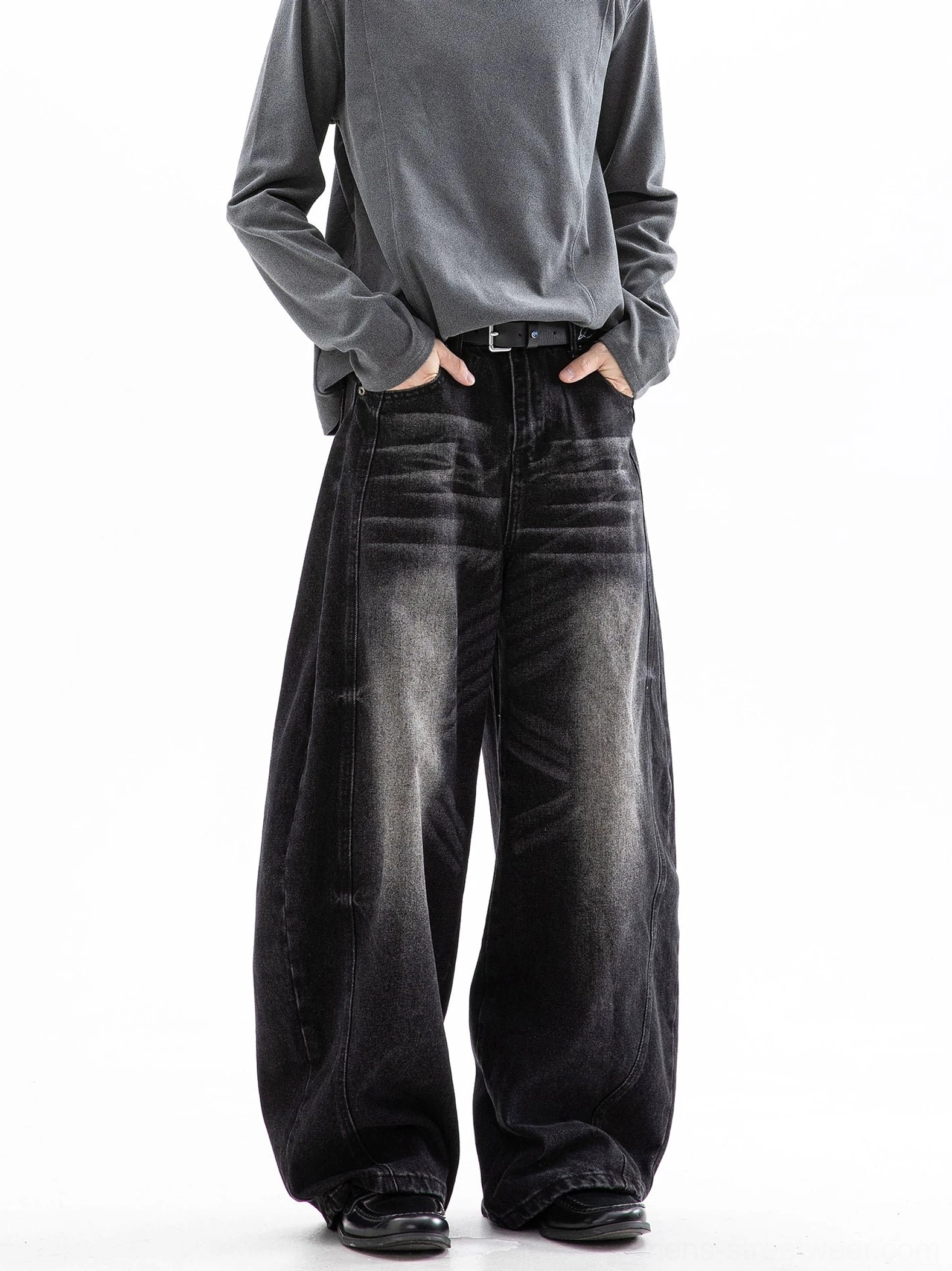 Washed black ultra wide leg denim jeans with curved side seams and faded hip detailing