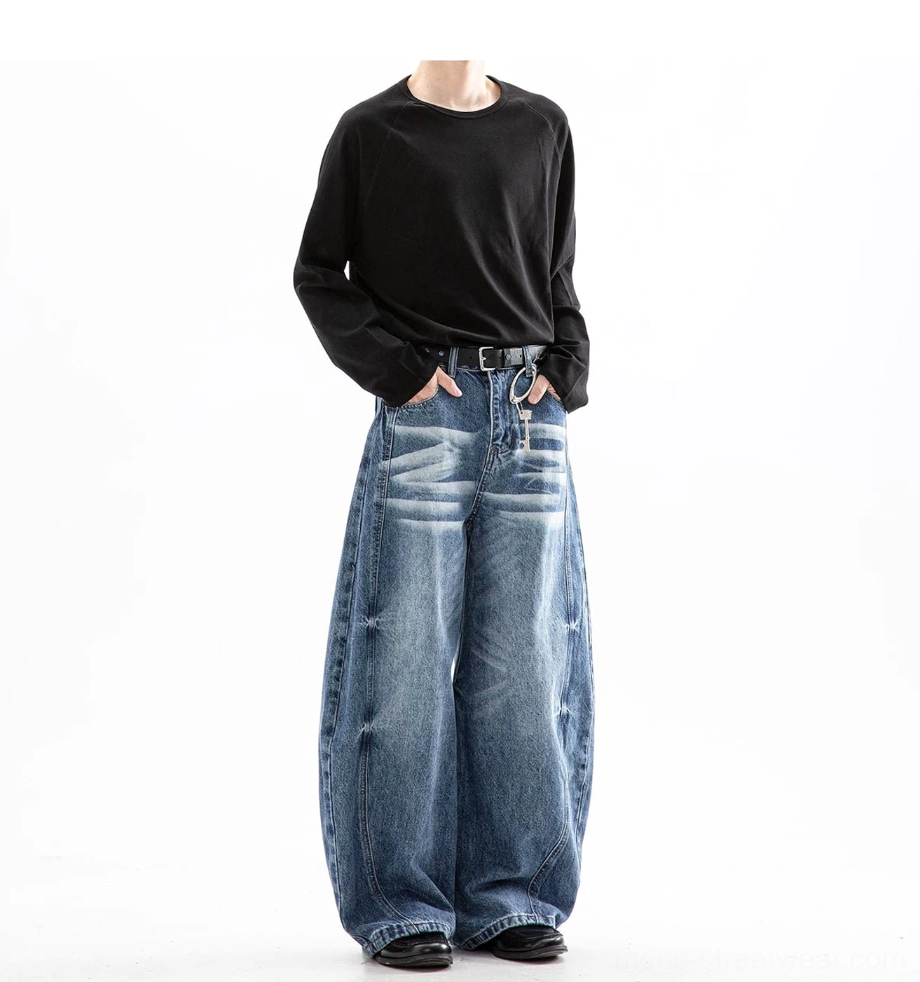 Light blue vintage wash ultra wide leg jeans with faded thighs decorative side seams and relaxed baggy fit