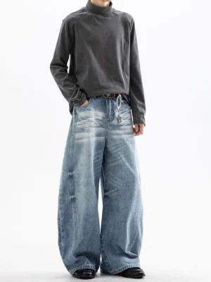 Light blue cloud washed ultra wide leg jeans with vintage faded thighs shown in a full body studio view