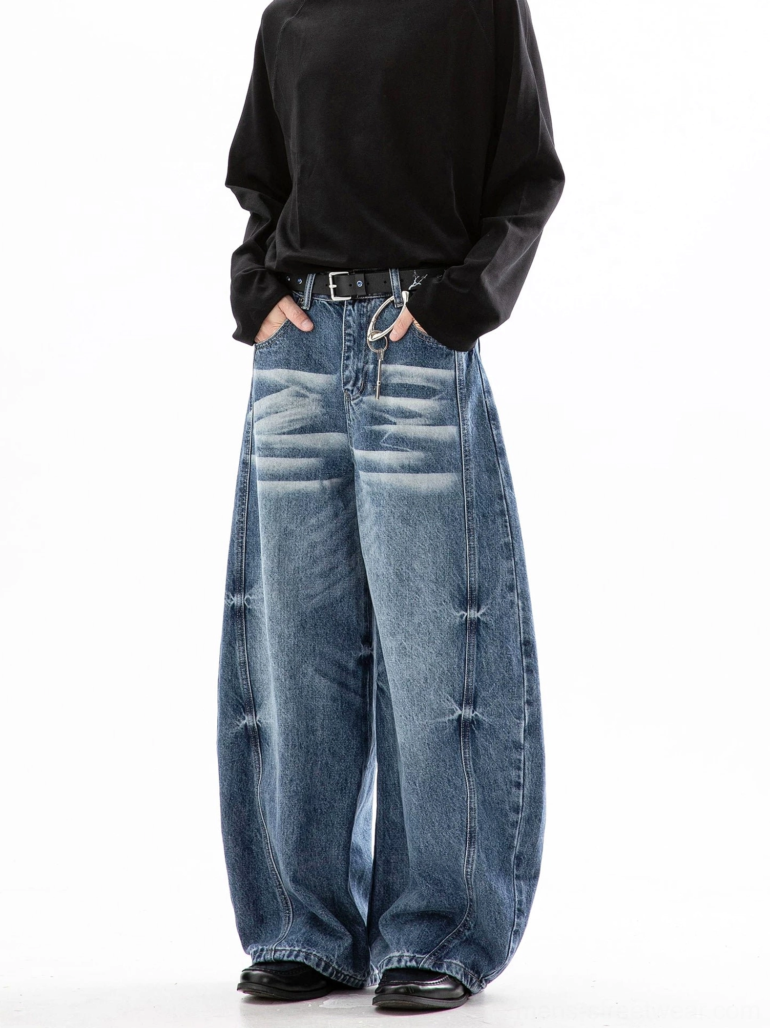 Light blue ultra wide leg jeans shown from a side front angle with cloud wash and structured baggy fit