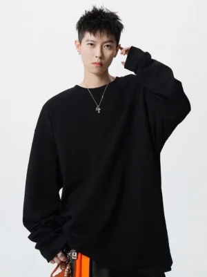 Black oversized crew neck long sleeve tee shown from the front with relaxed sleeves and a loose streetwear fit