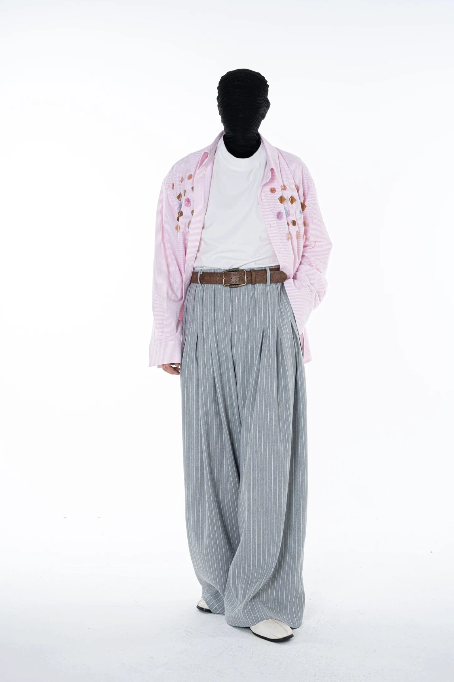 Full body streetwear outfit featuring Cloudline grey pinstripe pleated ultra wide leg trousers with a pink embroidered shirt
