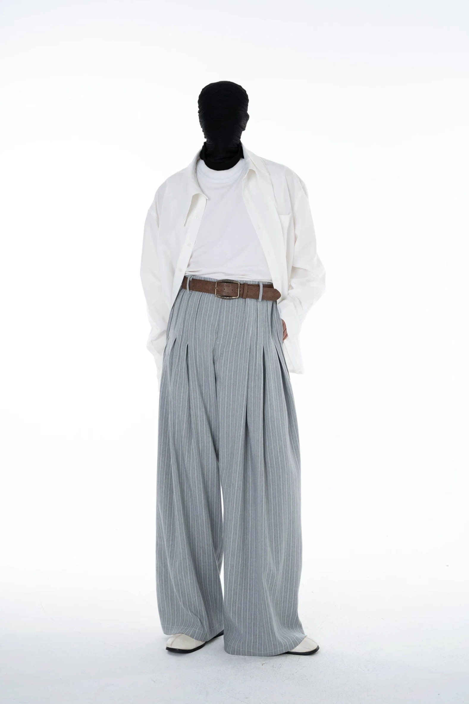 Cloudline grey pinstripe pleated ultra wide leg trousers styled with a loose white shirt and leather shoes