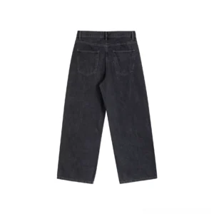 Rear view of washed black wide-leg streetwear jeans showing rectangular back patch pockets, belt loops, and relaxed silhouette