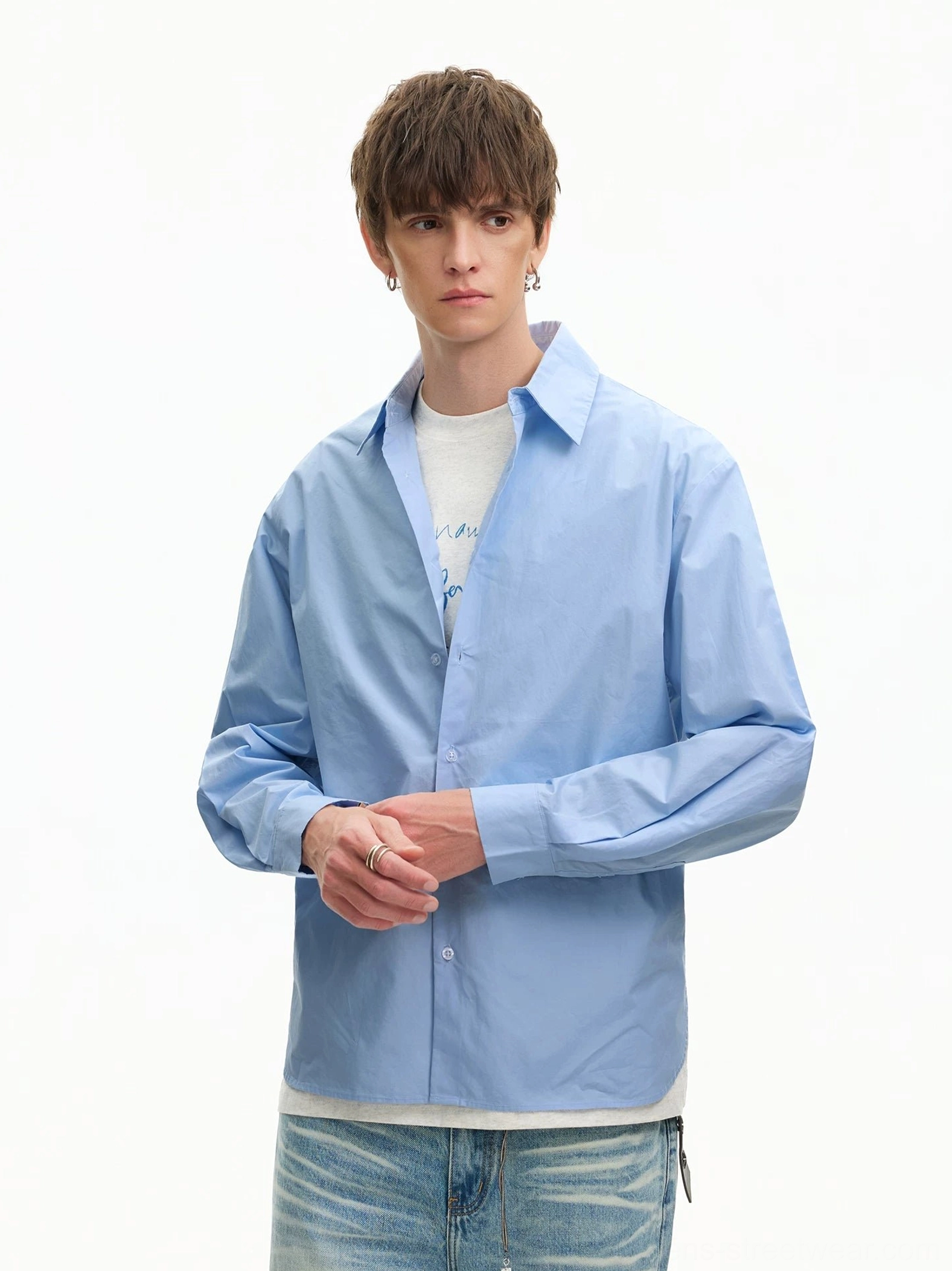 Light Blue oversized long-sleeve poplin shirt layered over white T-shirts with relaxed blue jeans and contemporary Asian styling