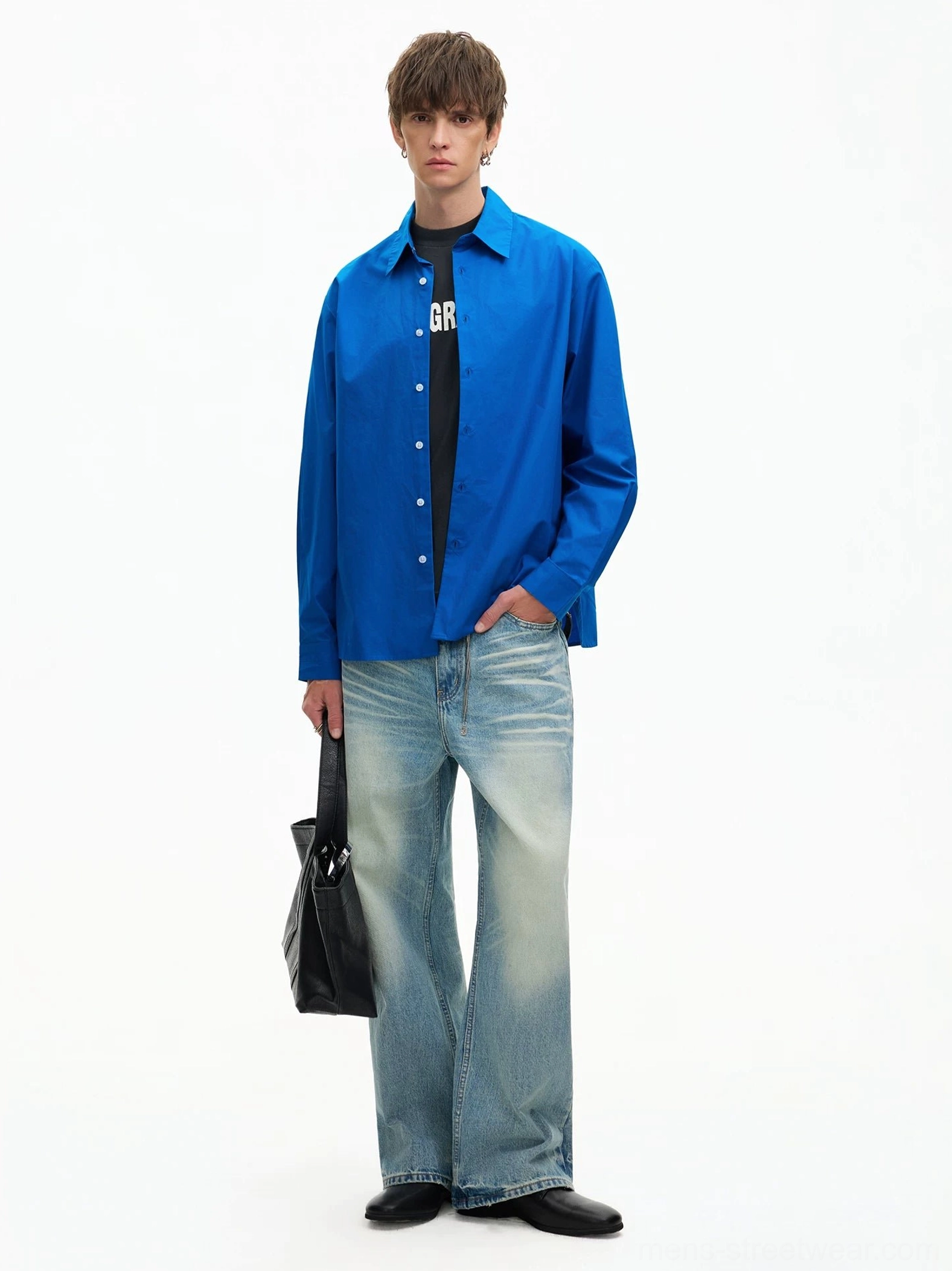 Royal Blue oversized poplin shirt styled with a black graphic tee, flared blue jeans, and a black handbag for Seoul street fashion