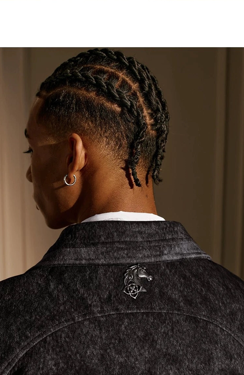 Coffee black textured Western yoke zip jacket rear collar close-up with metal emblem and textured fabric finish