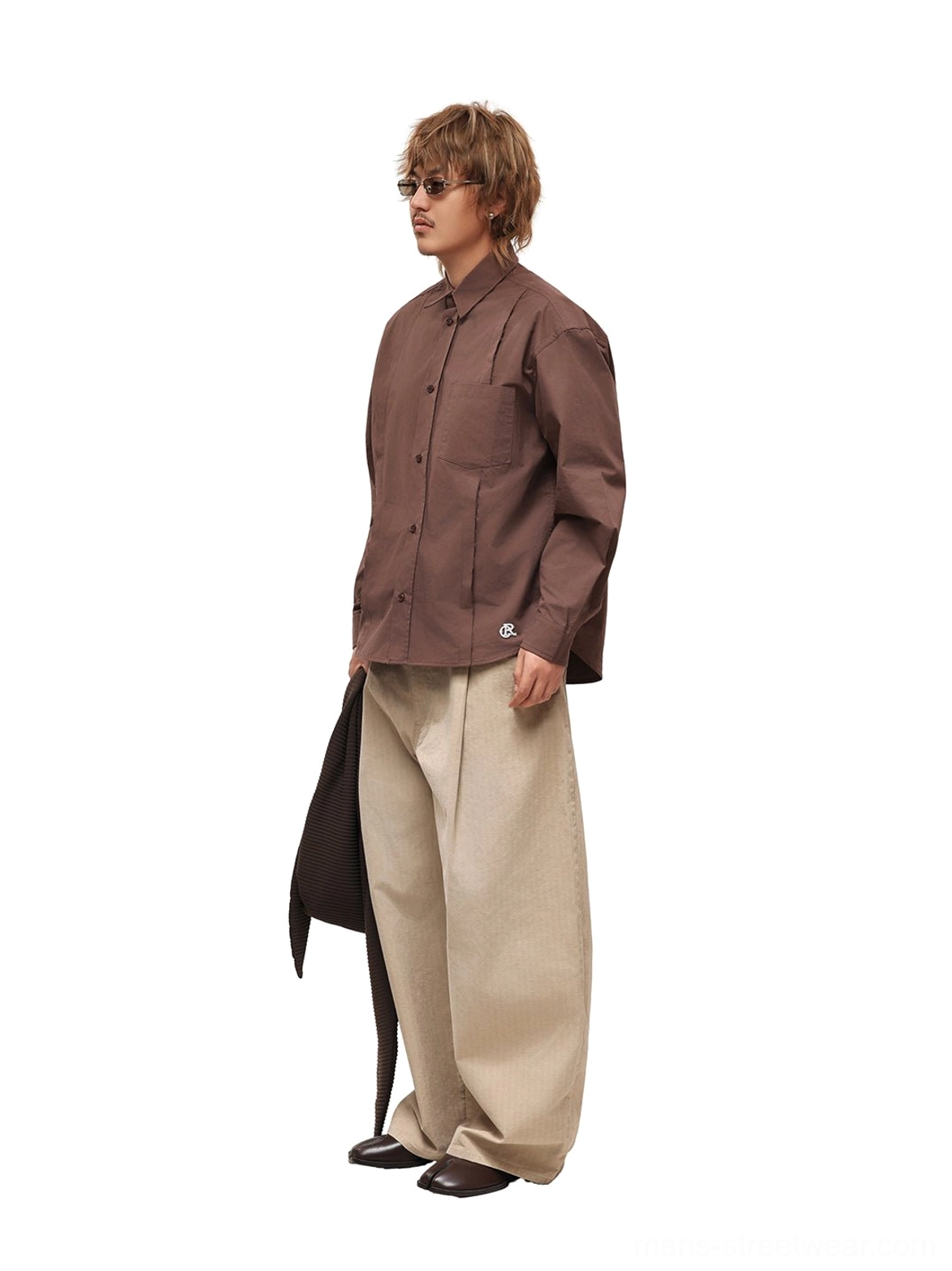 Coffee brown button-up poplin overshirt worn with beige trousers and leather shoes for minimal streetwear styling