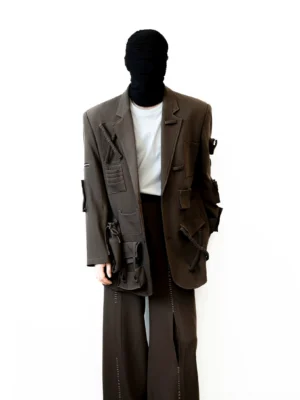 Coffee brown multi-pocket utility blazer worn in a full front view with oversized avant-garde streetwear silhouette