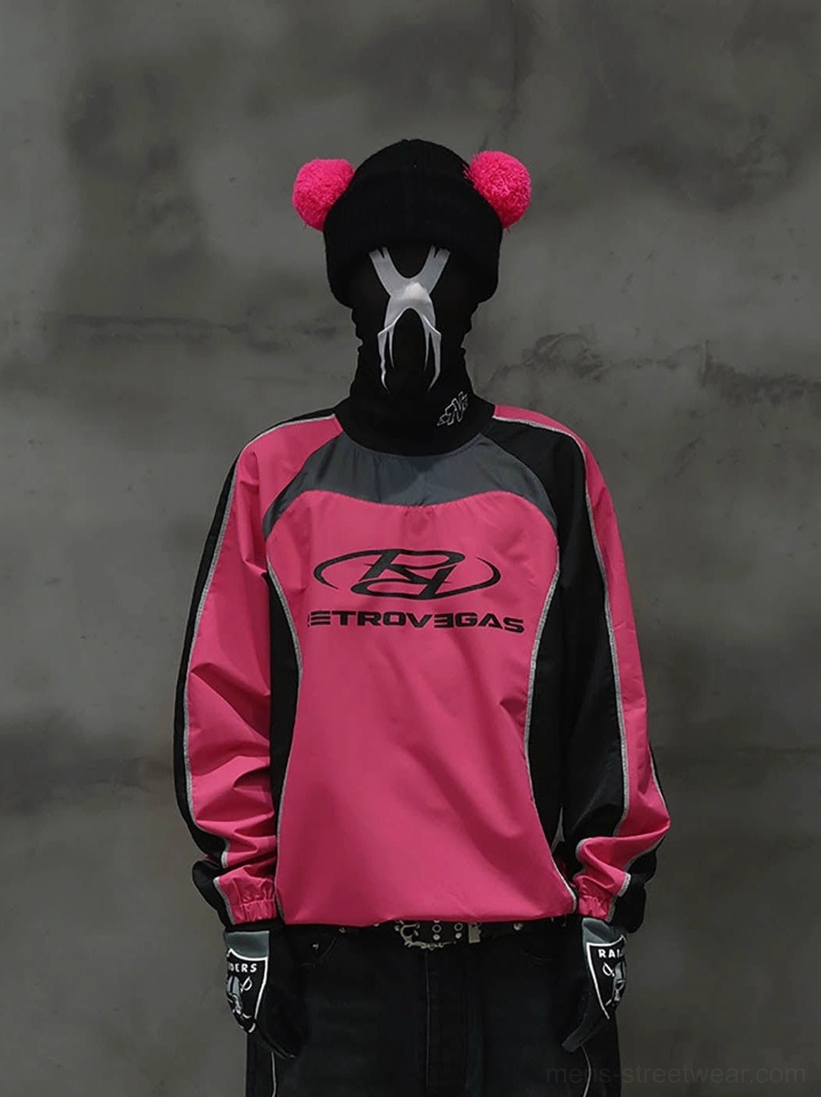 Hot pink and black color block racing raglan jersey styled with dark trousers and streetwear accessories