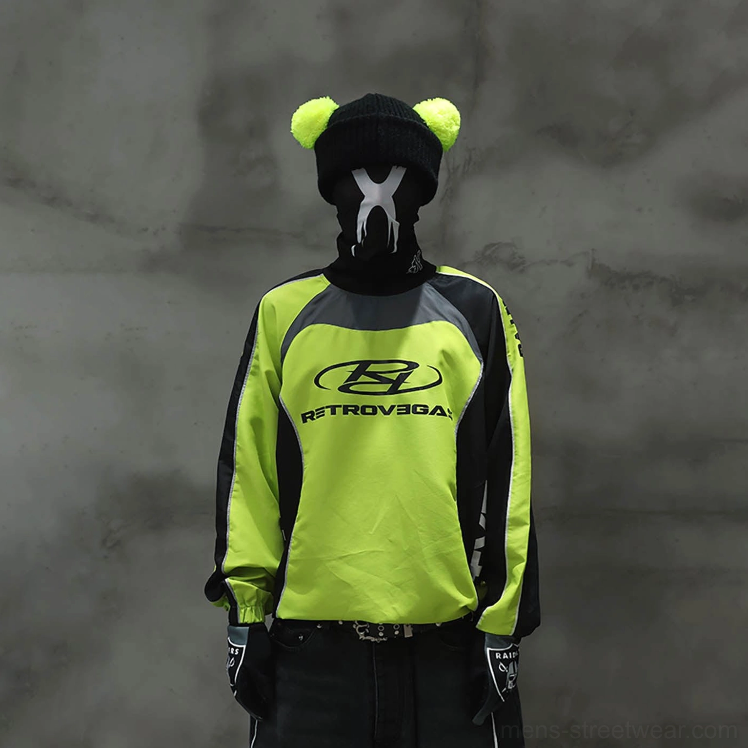 Neon lime green and black color block racing raglan jersey shown from the front in urban streetwear styling