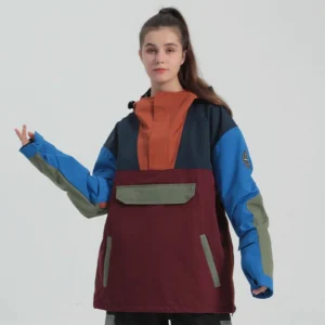 Relaxed-fit pullover snow anorak with multi-tone patchwork panels, flap chest pocket, and zippered hand pockets