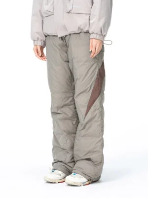Front view of khaki color-block splash-proof padded track pants with dark brown side panels in Korean gorpcore streetwear style