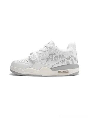 White colorblock basketball-inspired court sneaker side profile with graphic side detailing, adjustable strap, padded collar, and cushioned streetwear outsole
