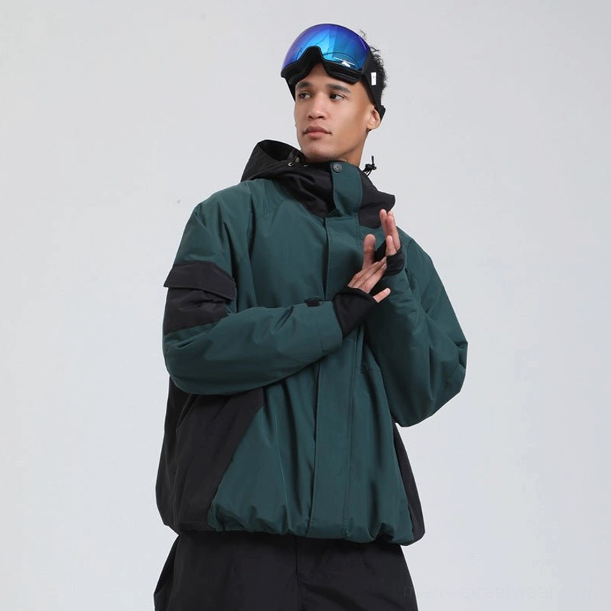 Dark green and black colorblock snowboard shell jacket with high neck hood and contrast shoulder panels front three-quarter view