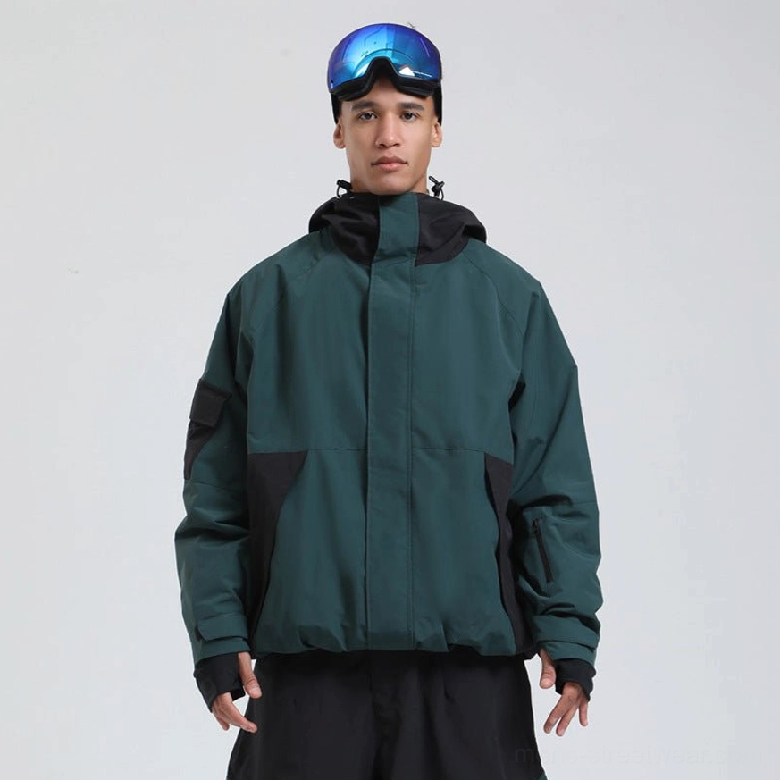 Dark green colorblock snowboard shell jacket with black technical details, adjustable hood and relaxed winter outerwear silhouette
