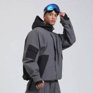 Dark grey and black colorblock snowboard shell jacket with adjustable hood and relaxed technical streetwear fit side view
