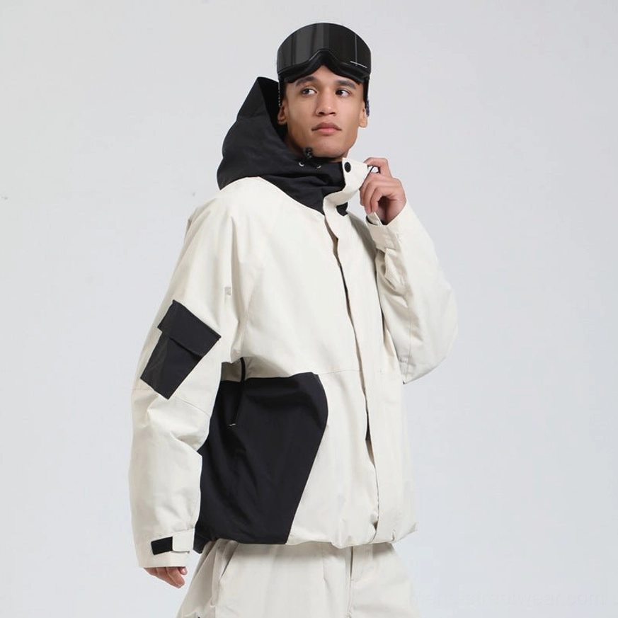 Off-white and black colorblock snowboard shell jacket with hood, utility waist pocket and contrast elbow panels front view