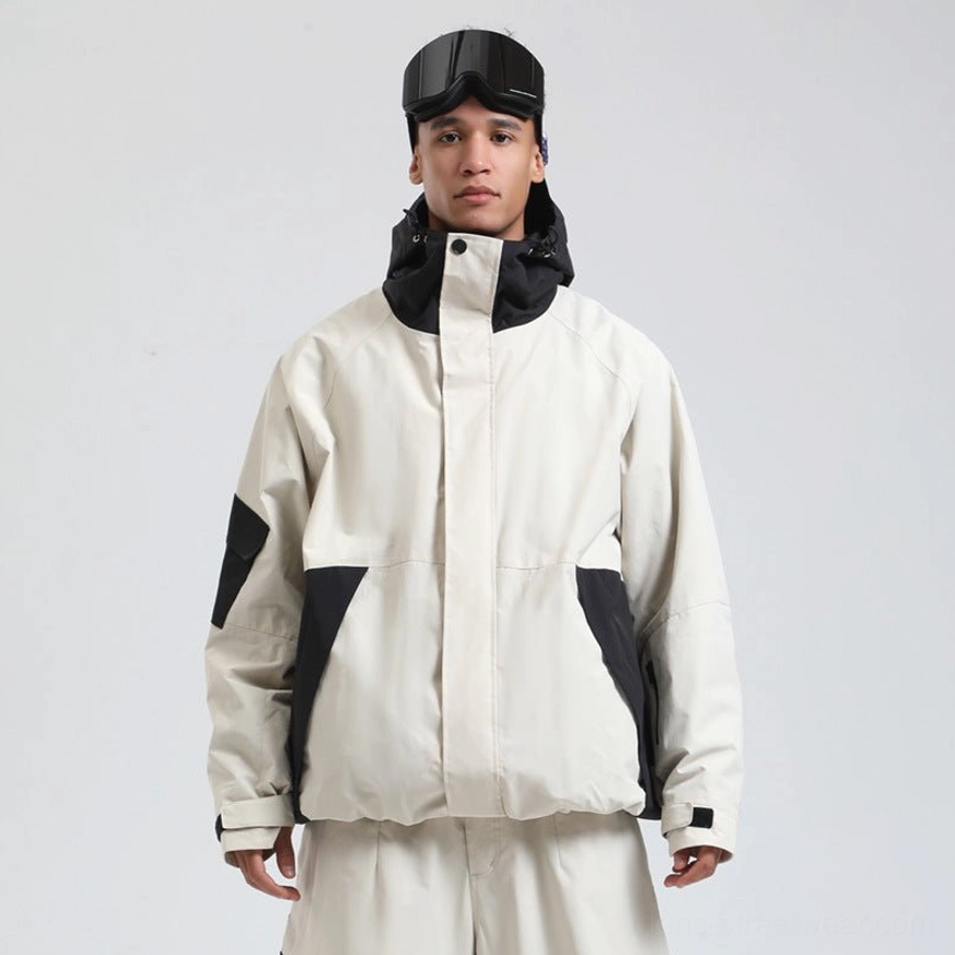 Off-white and black hooded snowboard shell jacket with front zipper and colorblock panels paired with ski pants