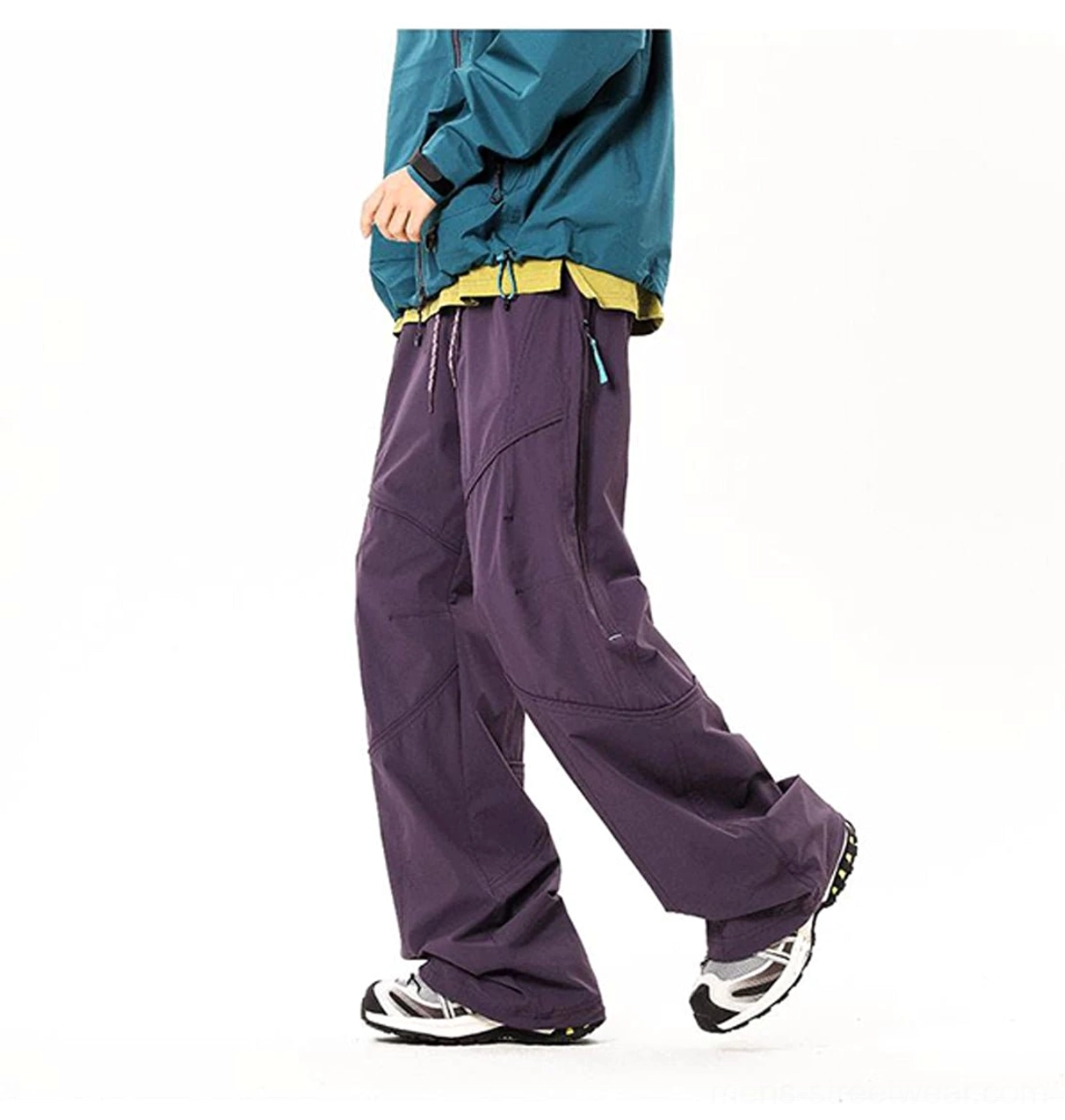 Dark purple wide-leg cargo pants shown from the side with tailored seams and functional utility pockets