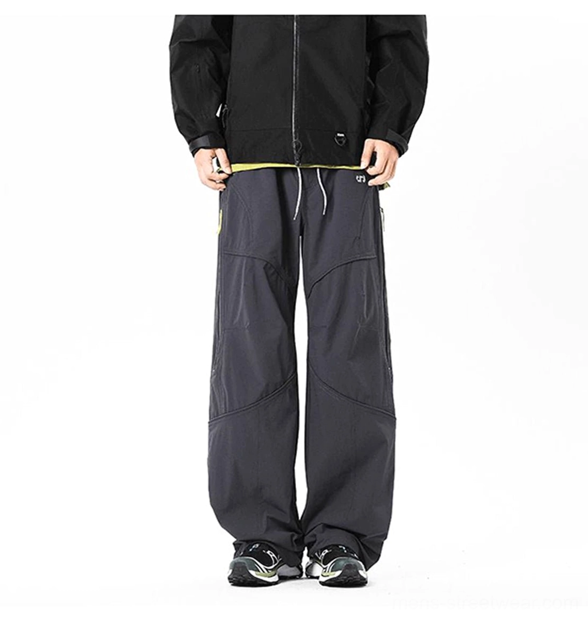 Relaxed men's techwear cargo pants with curved seams and contemporary wide-leg silhouette