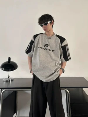 Colorblock varsity sport tee in a relaxed streetwear fit styled with wide-leg black trousers