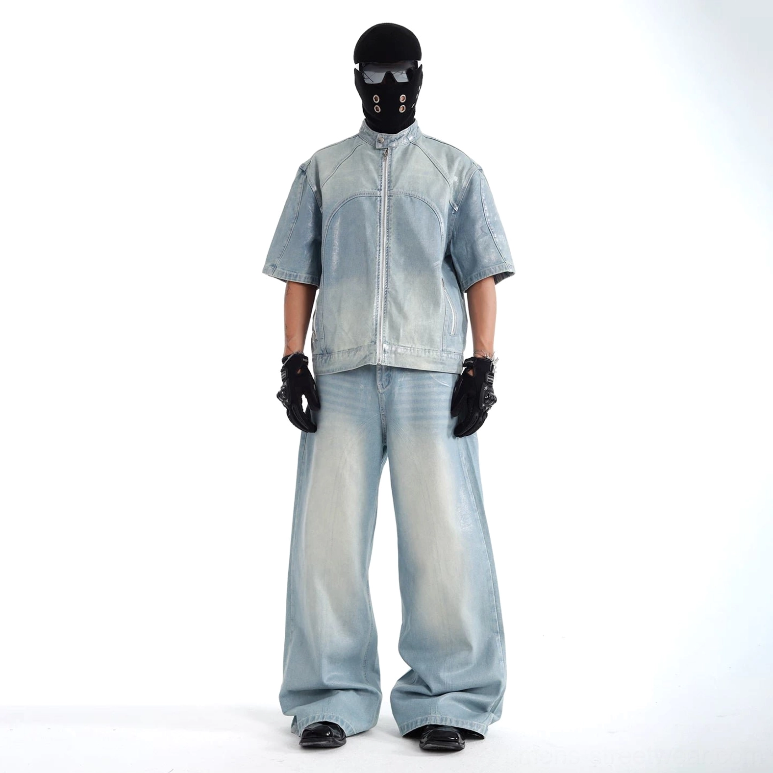 Full front view of complete faded blue acid wash denim set featuring short sleeve jacket and full length wide leg jeans