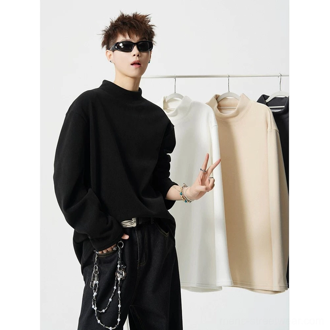 Contemporary boxy mock neck sweatshirt for wide leg trousers, distressed denim, and layered streetwear outfits